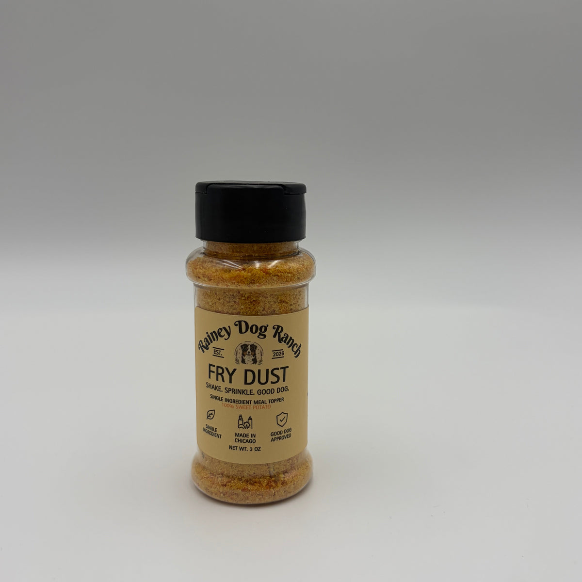 A small bottle of dog training spray labeled 'Puppy Crush Dry Dust' with a black cap, shown on a plain light gray background.